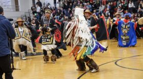 The Eagle Raven Dance Group brought the Ravenstail Weaving Our Pride robe to life during the Gold Medal basketball tournament at Juneau-Douglas High School: Yadaa.at Kalé.