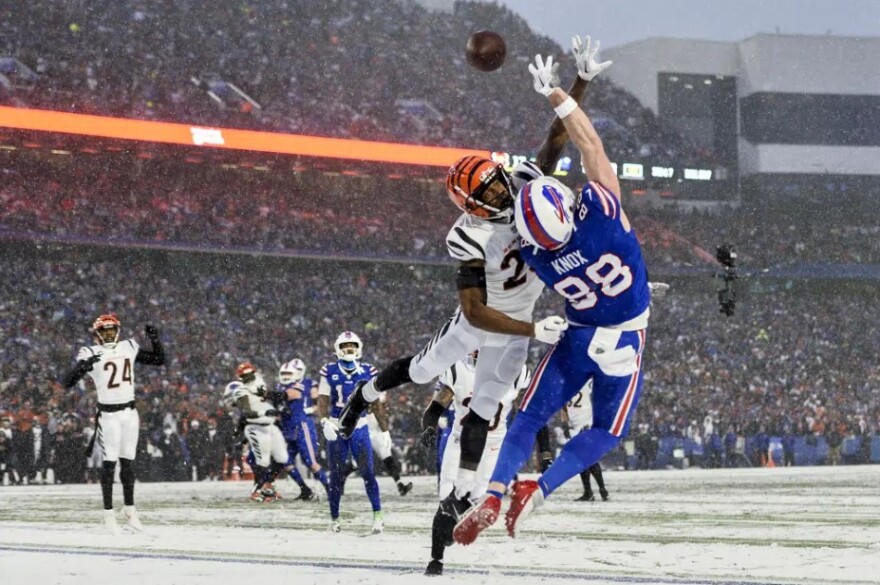 Cincinnati Bengals safety Dax Hill (23) breaks up a pass intended for Buffalo Bills tight end Dawson Knox (88) during the third quarter of an NFL division round football game, Sunday, Jan. 22, 2023, in Orchard Park.