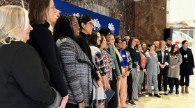 Employees of the State Department of Education, professors who issued reports related to the department's efforts, and educators from cities and towns in Connecticut gather for a photograph at Connecticut Education Department offices in Hartford.