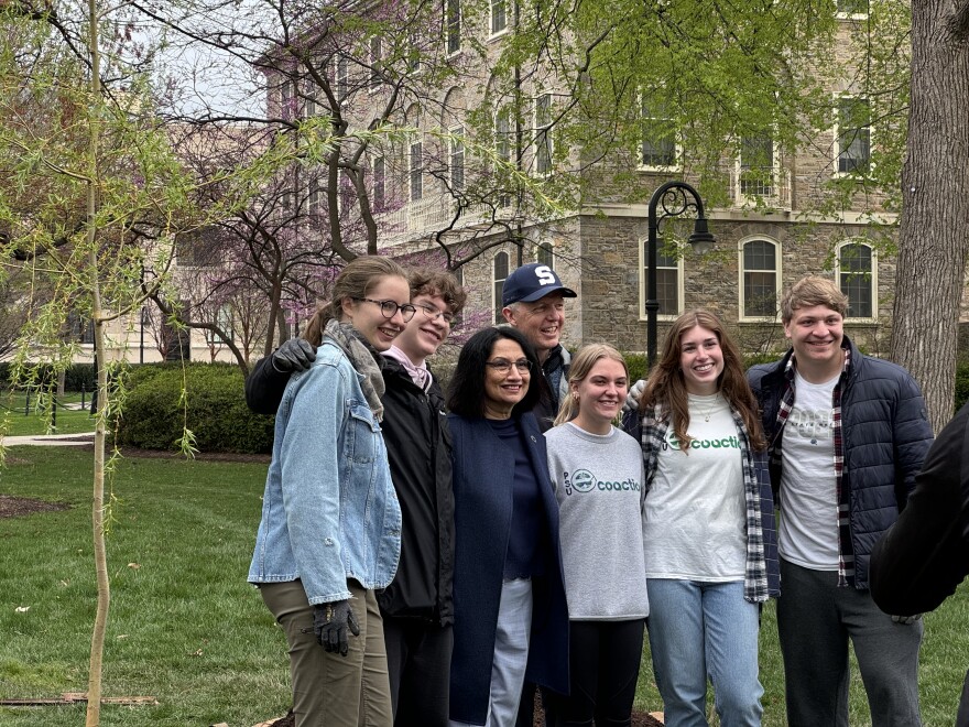 President Bendapudi and EcoAction members taking pictures with the new Old Willow.