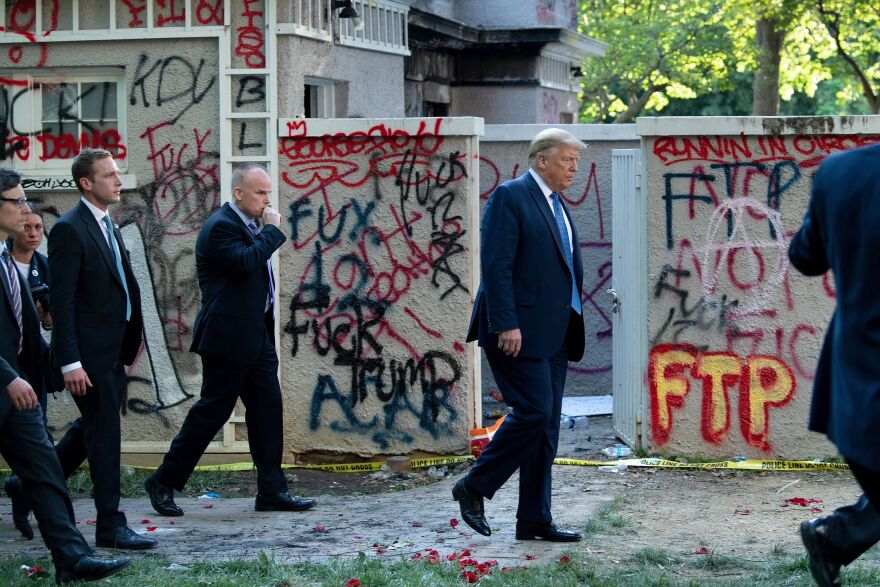 After police cleared the area using tear gas, President Trump emerged from the White House and was escorted through Lafayette Square to St. John's Episcopal Church for a photo on June 1.