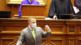 South Carolina Sen. Stephen Goldfinch, R-Murrells Inlet, gets ready to show fellow lawmakers he shaved off his beard on Thursday, April 22, 2021, in Columbia, S.C. Goldfinch offered to shave if senators could reach a compromise on a bill about state-owned utility Santee Cooper. (AP Photo/Jeffrey Collins)