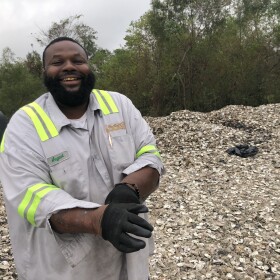 August Walker stands amongst thousands of oyster shells at the Coalition to Restore Coastal Louisiana's restoration headquarters in Violet, LA. Each week, August makes the rounds to some 35 New Orleans restaurants, collecting oyster shells which will eventually make their way back to the water. The effort is part of the Oyster Recycling Program run by the Coalition to Restore Coastal Louisiana, or CRCL. It's one of around 10 oyster recycling operations in the country.