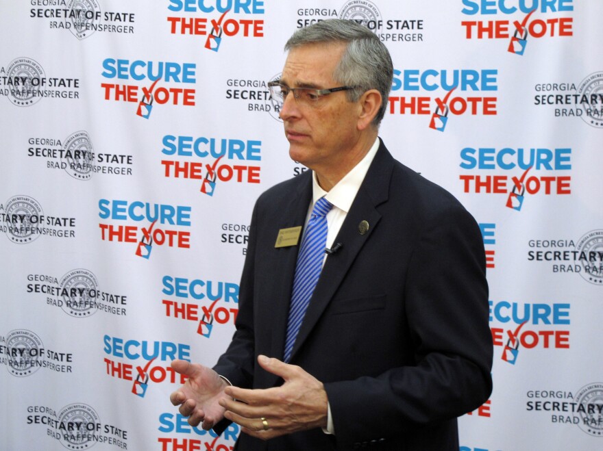 Georgia Secretary of State Brad Raffensperger speaks with a reporter in December in Savannah.