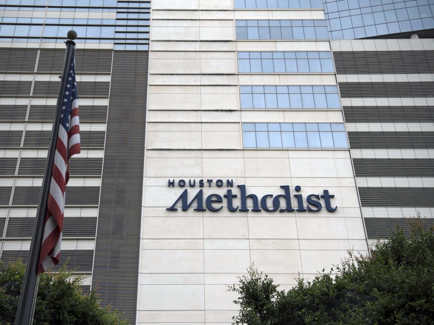 An American flag flies outside the Houston Methodist Hospital at the Texas Medical Center (TMC) campus in Houston, Texas.