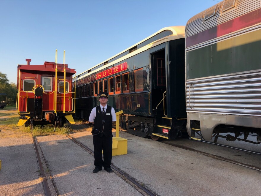 Arkansas & Missouri Railroad excursion conductor, Nick Walker, stands by for departure.