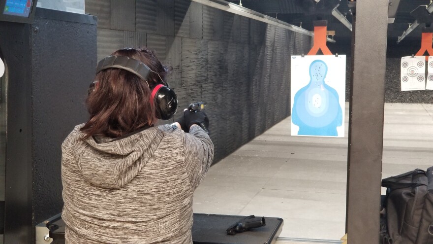 Reno-resident Tammy Nechita practices with the handgun she owns.