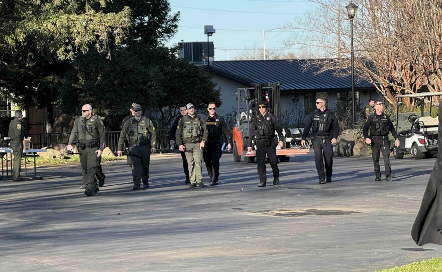 Law enforcement officers patrol the memorial for Congressman Doug LaMalfa on Jan. 24, 2026, in Chico.