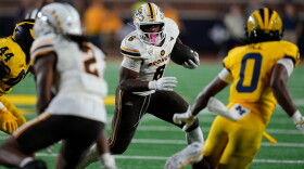 Western Michigan running back Jalen Buckley (6) runs the ball against Michigan during the second half of an NCAA college football game Saturday, Sept. 5, 2026, in Ann Arbor, Mich. (AP Photo/Paul Sancya)