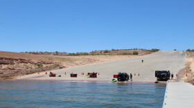 Visitors to Lake Powell unload non-motorized watercraft at Stateline boat ramp. The reservoir's low level prompted the ramp's closure to all motorized boats.
