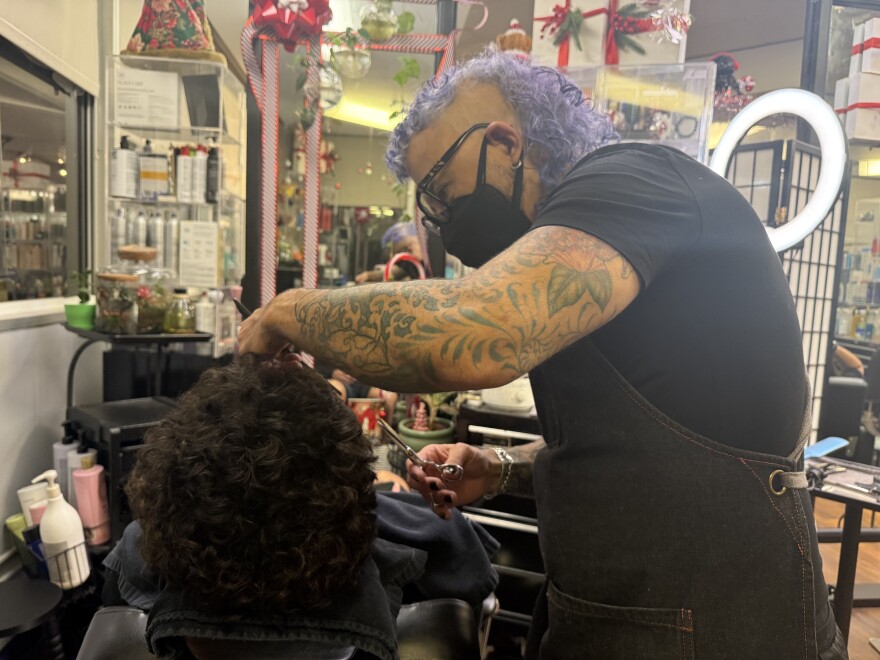 Hawai‘i hair stylist Jason Victorino cuts a client's hair at Salon 808 in Honolulu.