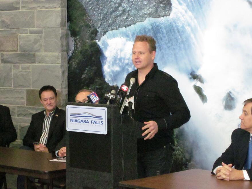 Nik Wallenda speaks to reporters at the Niagara Falls International Airport, one day after Canadian officials gave their approval to his request to hold a high-wire walk over Niagara Falls some time later this year.