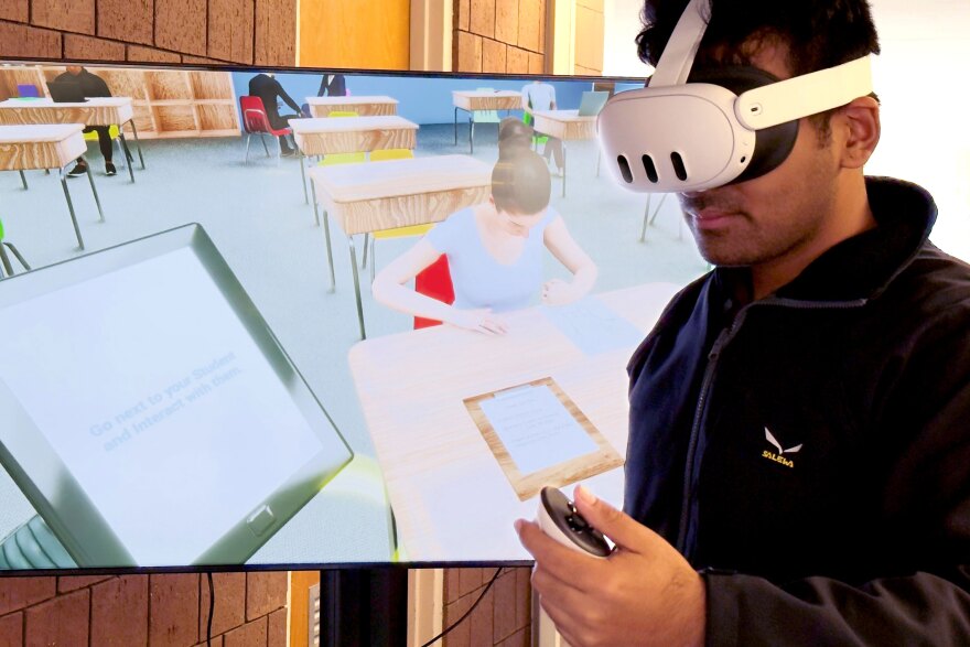 A researcher at Mississippi State University tests out the virtual reality training for teachers. Utah State University professor Casey Clay is working with a team that includes researchers from Vanderbilt University, the University of Virginia, and Mississippi State University.