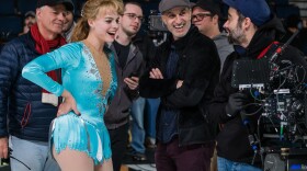 Margot Robbie as Tonya Harding and director Craig Gillespie in a promotional photo.