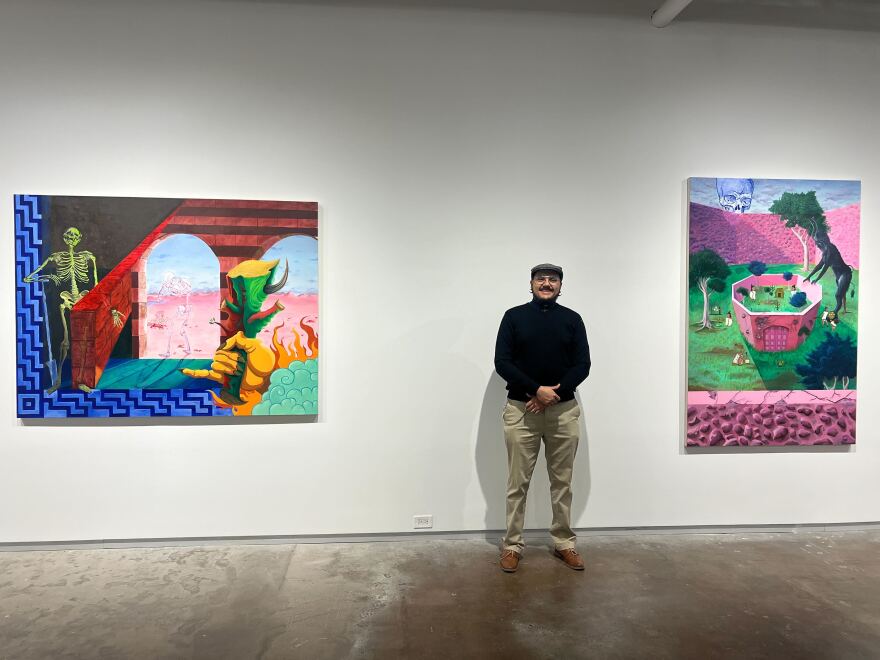 Alfredo "Freddy" Ortega Marquez, a graduate student at the University of North Texas, standing in front of his oil paintings at Dallas Contemporary on February 13, 2026.