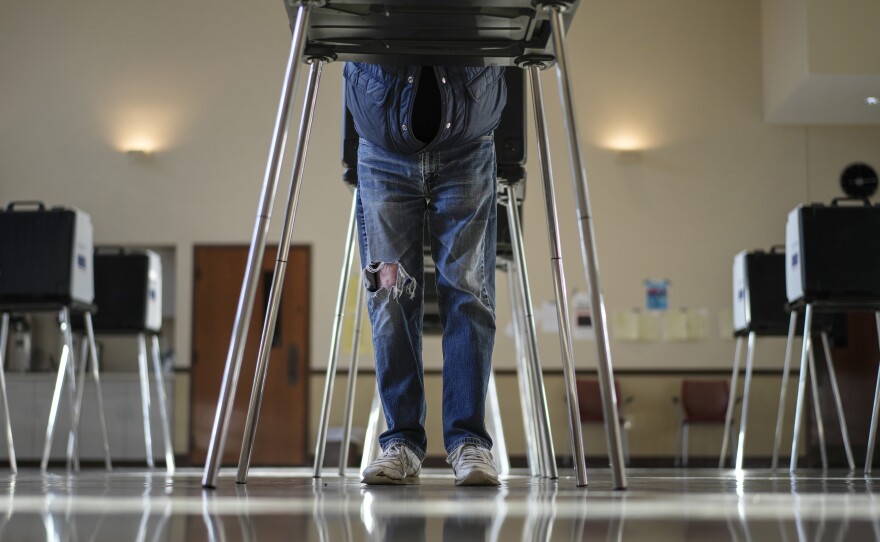 A voter fills out their Ohio primary election ballot at a polling location in Knox Presbyterian Church in Cincinnati, Ohio, on Tuesday, March 19, 2024.