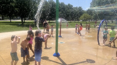 Children cool off Wednesday at the Twin Branch Park splash pad in Mishawaka.
