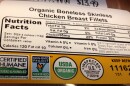 The label on the back of a chicken breast package. It reads, "Organic Boneless Skinless Chicken Breast Fillets" and has nutrition facts and, several labels that read "Certified humane, USDA, non-gmo project certified and inspected by the U.S.Department of Agriculture."