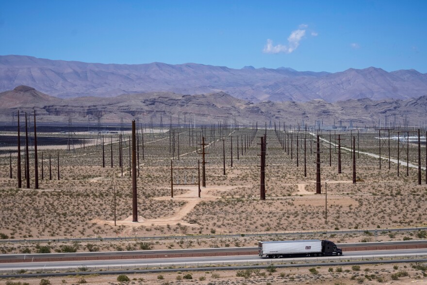 A truck is driven past electrical infrastructure, Thursday, April 2, 2026, in North Las Vegas. (AP Photo/Ty ONeil)