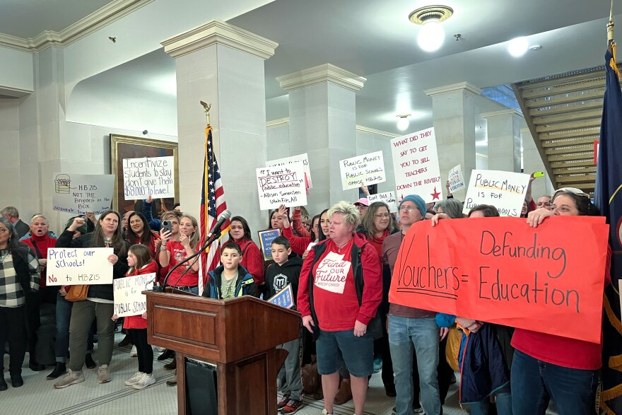 The leaders of several Utah education groups held a press conference at the State Capitol on Monday, Jan. 23, 2023, to express their opposition to HB215, a bill that would give teachers a pay raise and create a school voucher program. Public educators and their families showed up to the rally with signs and wore red.