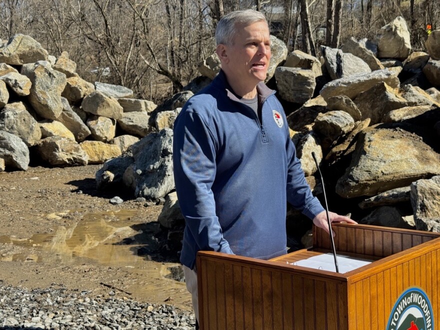 Gov. Josh Stein speaks alongside the French Broad River in Woodfin on Feb. 16, 2026.