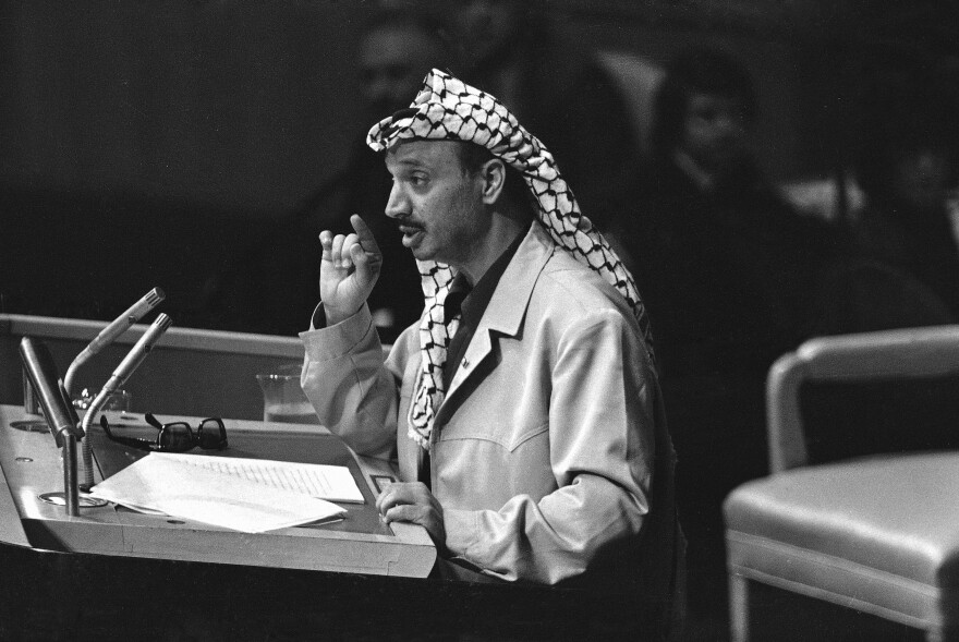 Yasser Arafat speaks at the United Nations in 1974. At the end of his speech, Arafat shook his finger at the delegates and declared, "I have come bearing an olive branch and a freedom fighter's gun. Do not let the olive branch fall from my hand."