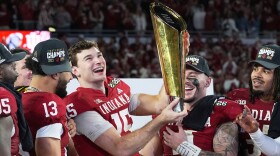 Indiana quarterback Fernando Mendoza holds the trophy after their win against Miami in the College Football Playoff national championship game, Monday, Jan. 19, 2026, in Miami Gardens, Fla.