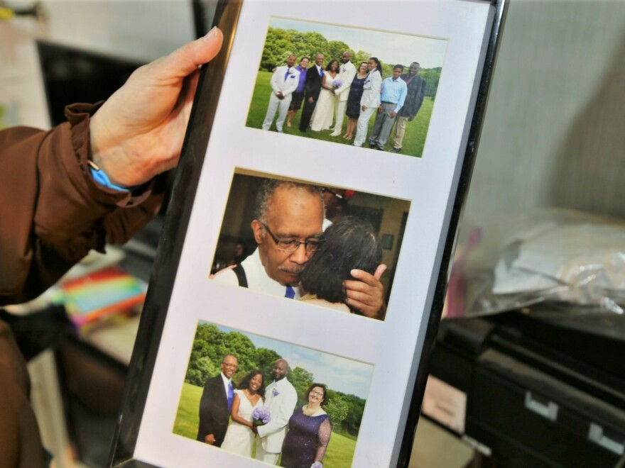 Sharon Gwinn holds a picture of her husband, who had Lewy body dementia toward the end of his life. Reckless financial behavior was one of the first signs of the disease. "It's what attacked his brain first," Gwinn says.