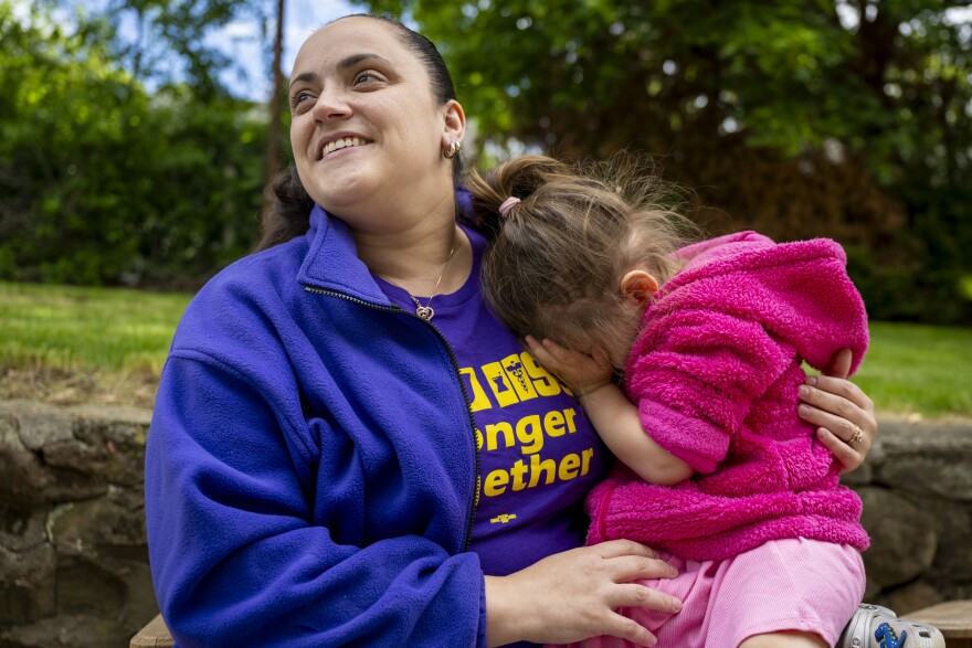 Natasha Forresters two year old daughter clung to her mom, making the most of a rare day at home together. Forrester is among nursing home workers across the state who continues to struggle with poor pay and high job stress.