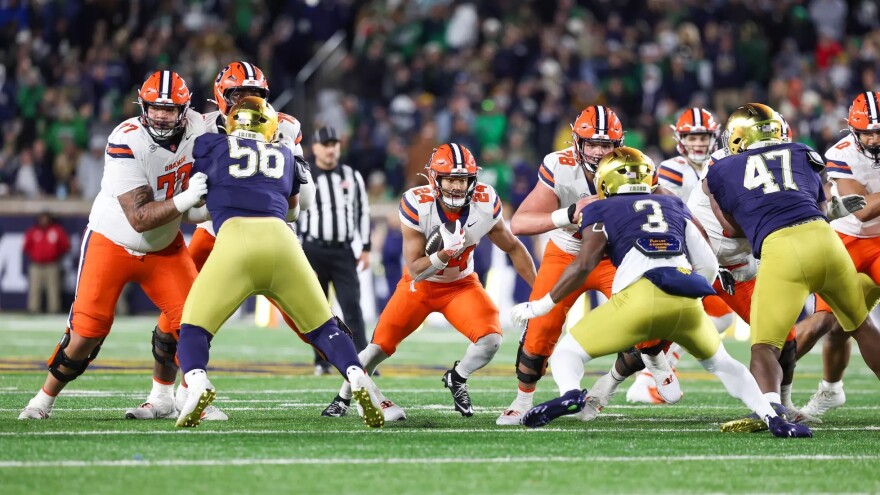 RB Will Nixon (24, White) rushes through a gap in SU’s loss to No. 9 Notre Dame