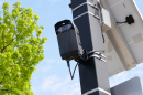 A solar-powered urban surveillance camera is mounted on a pole in this file photo.