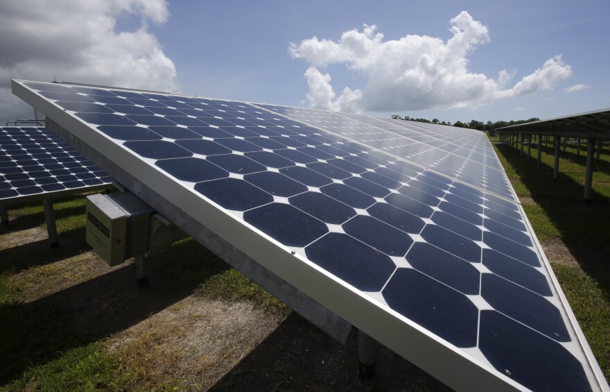 In this Wednesday, May 13, 2015 photo, some of the more than 37,000 solar panels gather sunlight at the Space Coast Next Generation Solar Center, in Merritt Island, Fla. Industry experts rank Florida third in the nation in rooftop solar energy potential but 13th in the amount of solar energy generated. Renewable energy experts and the solar industry say Florida lags behind because the state is one of only four that require solar energy to be sold exclusively by utilities. (AP Photo/John Raoux)