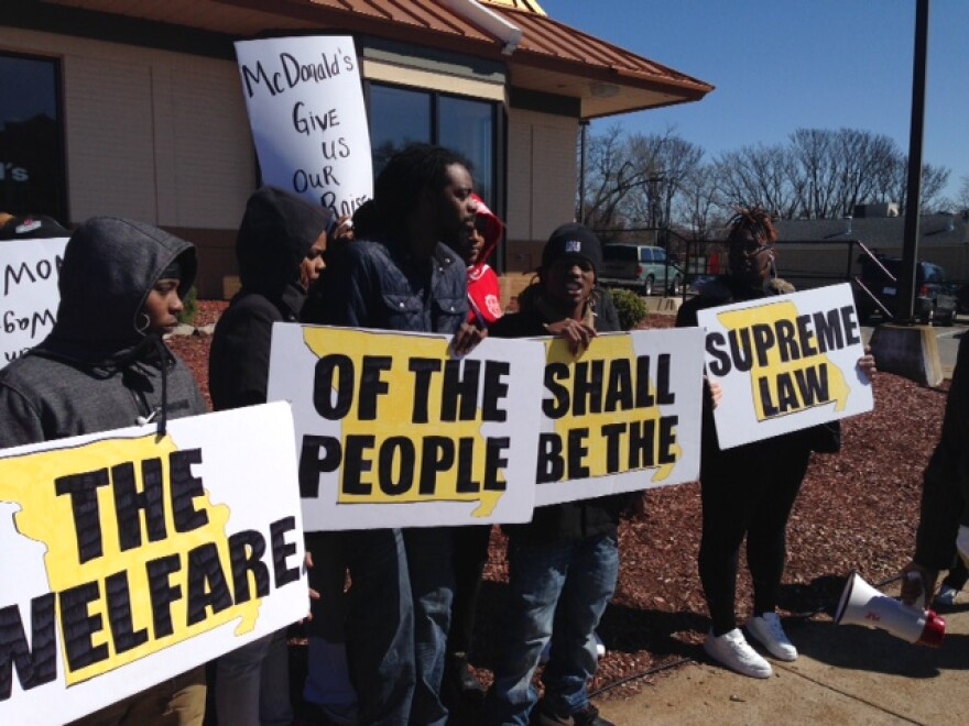 Fast food workers take part in a protest organized by Show Me $15 outside a McDonald's on Natural Bridge Road in St. Louis on March 15, 2017. They want the city's $10 minimum wage increase to be enforced immediately.