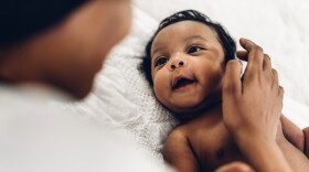 Image of baby looking at parent