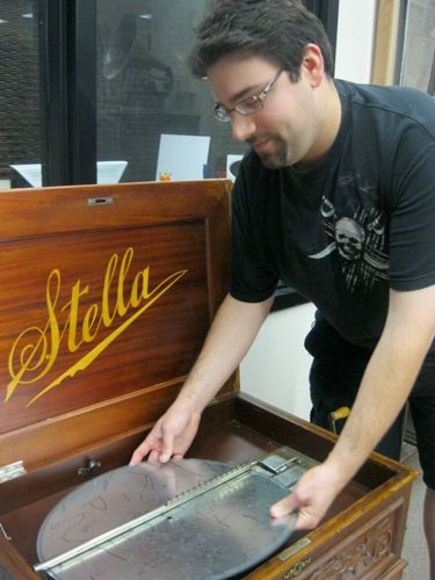 Dan Warneke used computer software to design this disc for an antique music box. Each pinhole represents a star in the skies over UMKC. When the disc is played, each pinhole causes a note to sound. Photo by Brenna Daldorph/KCUR.