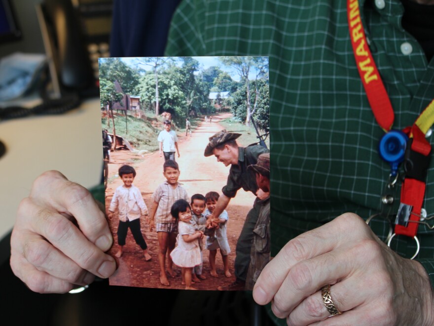 A close-up of Hall's photograph of his conversation with children in a Vietnamese village. He served in the Marine Corps during the Vietnam War — an important part of his personal story.