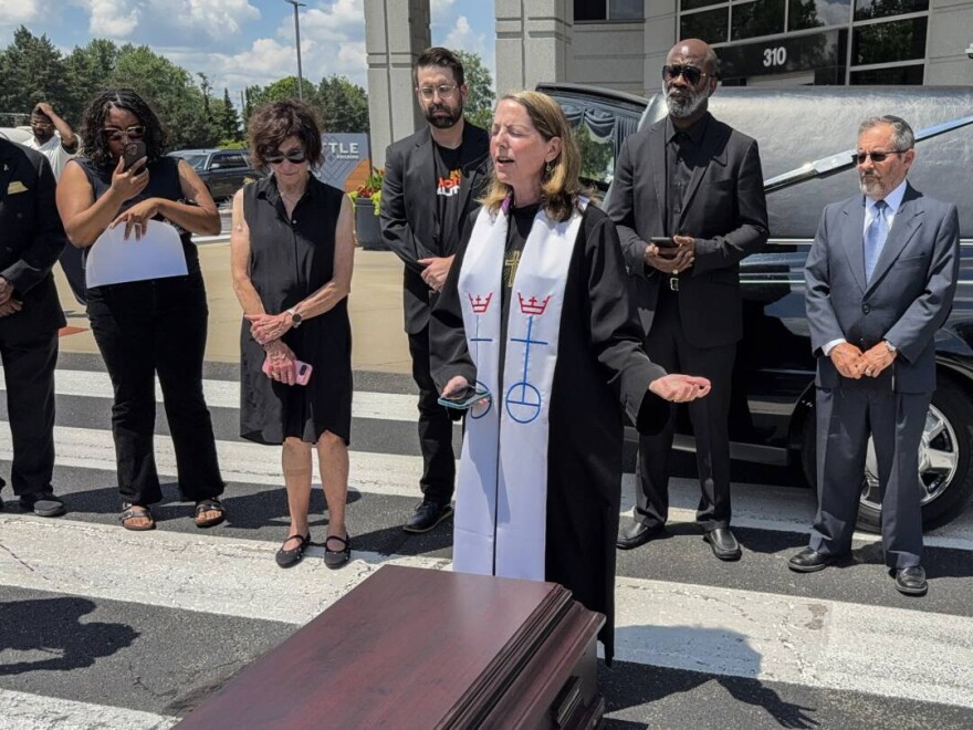 Indiana faith leaders held a funeral service outside U.S. Sen. Todd Young's (R-Ind.) Indianapolis office on July 3, 2025, in protest of the federal tax and spending cut bill that will sever access to health care and food benefits for hundreds of thousands of Hoosiers.