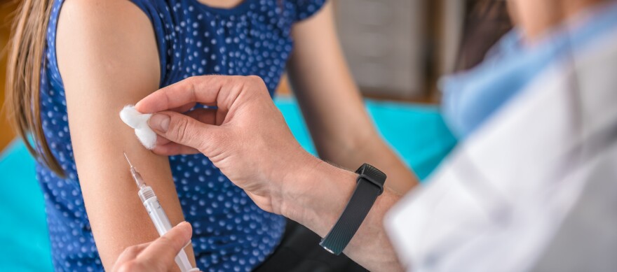 This stock photo shows a doctor giving a young girl a vaccine shot. Gov. Kathy Hochul said Wednesday, Oct. 19, 2022, that children ages 5 and older are now eligible to receive the new bivalent COVID-19 booster shot.