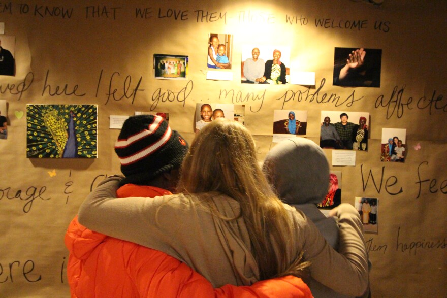 Attendees of the Refugee Assistance & Immigration Services (RAIS) art show held Feb. 3 in support of those affected by President Trump's executive order (Photo: RAIS)
