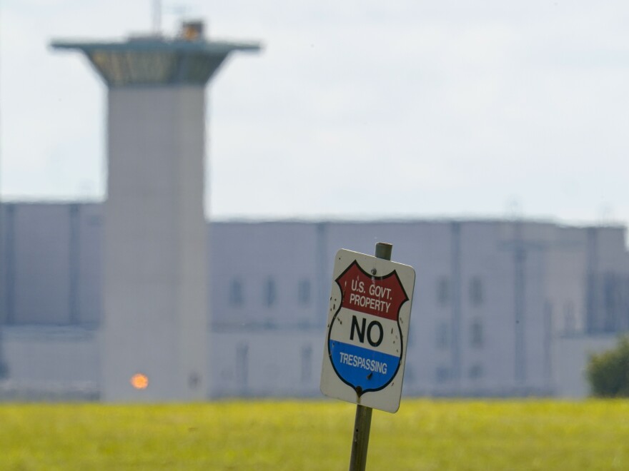 FILE - In this Aug. 26, 2020, file photo, the federal prison complex in Terre Haute, Ind. All federal prisons in the United States have been placed on lockdown, with officials aiming to quell any potential violence that could arise behind bars as law enforcement prepares for potentially violent protests across the country in the run-up to President-elect Joe Biden's inauguration on Wednesday. (AP Photo/Michael Conroy, File)