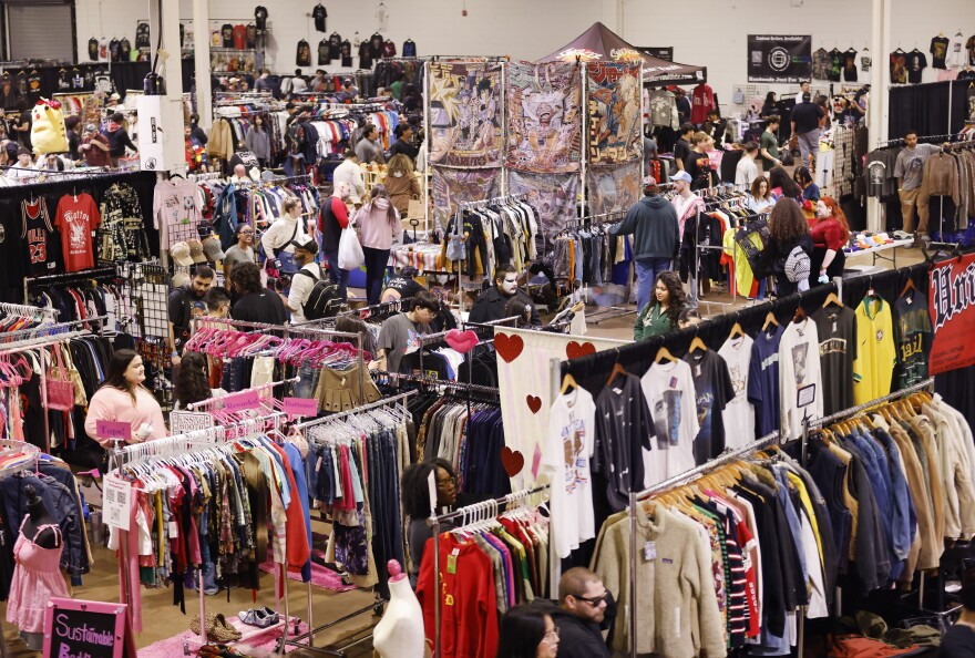 Racks of clothing fill Swap Con, an event where vendors and thrifters go to exchange items and buy discounted items, in Dallas Market Center, February 1, 2025.