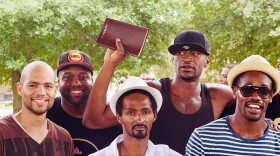 George Floyd holds up a Bible. (Resurrection Houston/Nijalon Dunn)