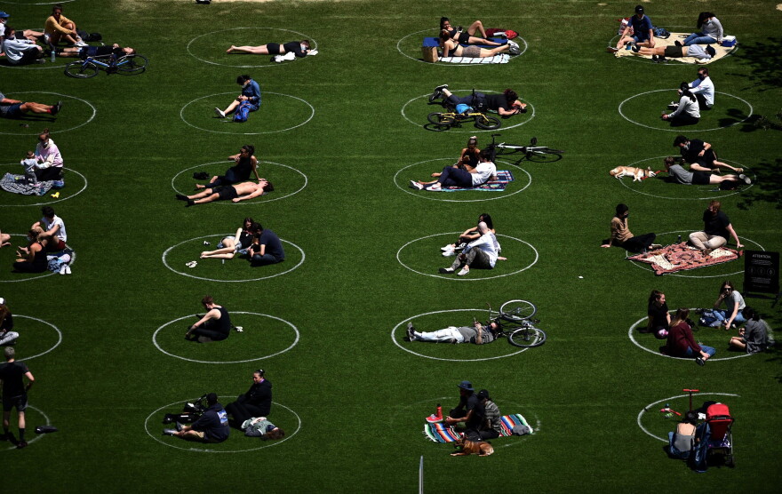 People are seen social distancing in Brooklyn. (Johannes Eisele/AFP via Getty Images)