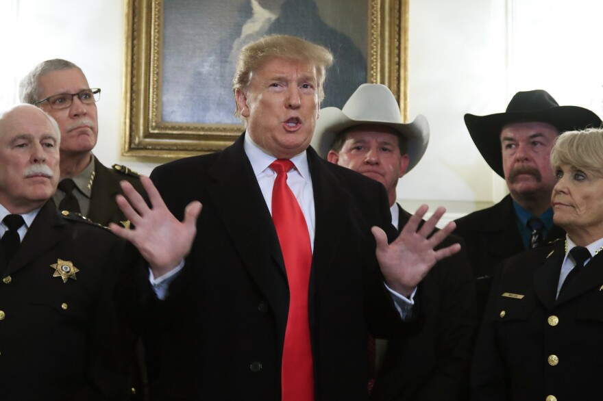 President Donald Trump speaks during a meeting with a group of sheriffs from around the country before leaving the White House in Washington, Monday, Feb. 11, 2019, for a trip to El Paso, Texas. 