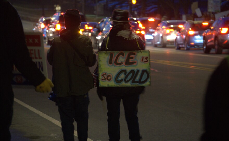 Hundreds of protesters line Pattonwood Drive in Irondequoit near the U.S. Customs and Border Protection's Rochester border patrol station on Thursday, Jan. 8, 2026, protesting the shooting death of a woman in Minneapolis by an Immigration and Customs Enforcement the day before.