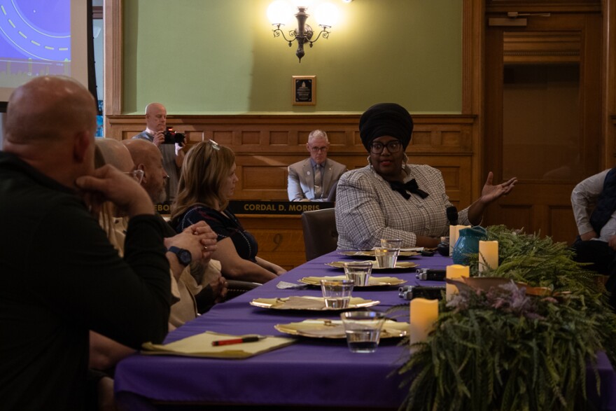 Erin Patrice of The Breaking Bread Village facilitates a public forum in Bay City Hall on Monday, March 23, 2026.