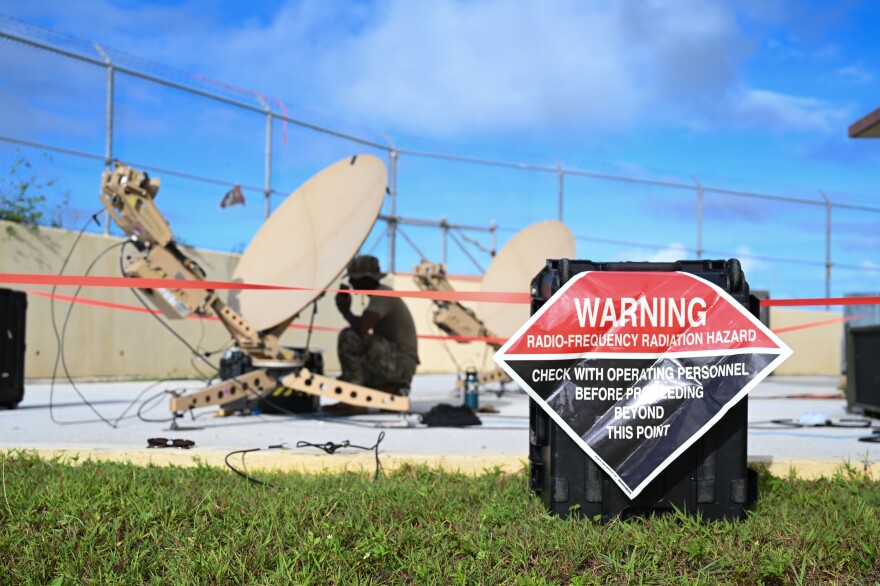 A hazard warning sign marks the area where satellite communication dishes were erected by 644th Combat Command Squadron Airmen at the Pacific Regional Training Center, Andersen Air Force Base, Aug. 9, 2024.