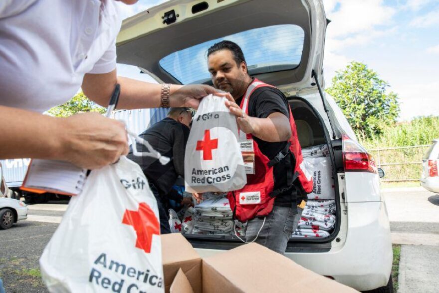  January 19, 2020. Mayagüez, Puerto Rico. Supplies are loaded into vehicles at a service delivery site.