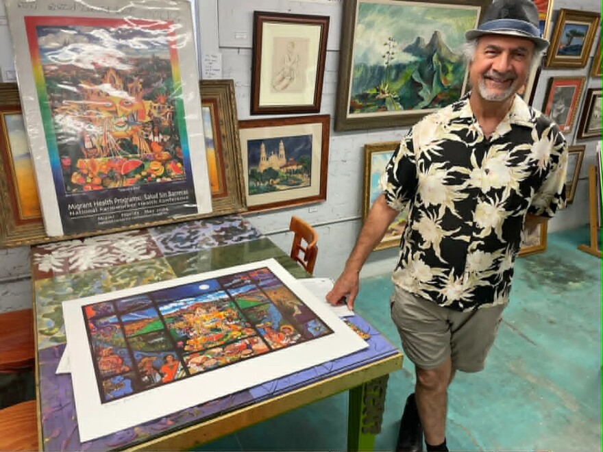 Artist Hal Marcus with prints of his "El Paso Gracias a Dios" painting that was displayed at the Chamizal National Memorial for more than 30 years.