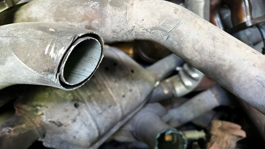 This photo provided by the Phoenix Police Department shows stolen catalytic converters that were recoverd after detectives served a search warrant at a storage unit in Phoenix on Thursday, May 27, 2022. The bust came amid a national surge in thefts of the pricy auto parts that play a critical in reducing vehicle emissions and has led lawmakers in 36 states and in Washington D.C. to consider new laws to address the problem. (Phoenix Police Department via AP)